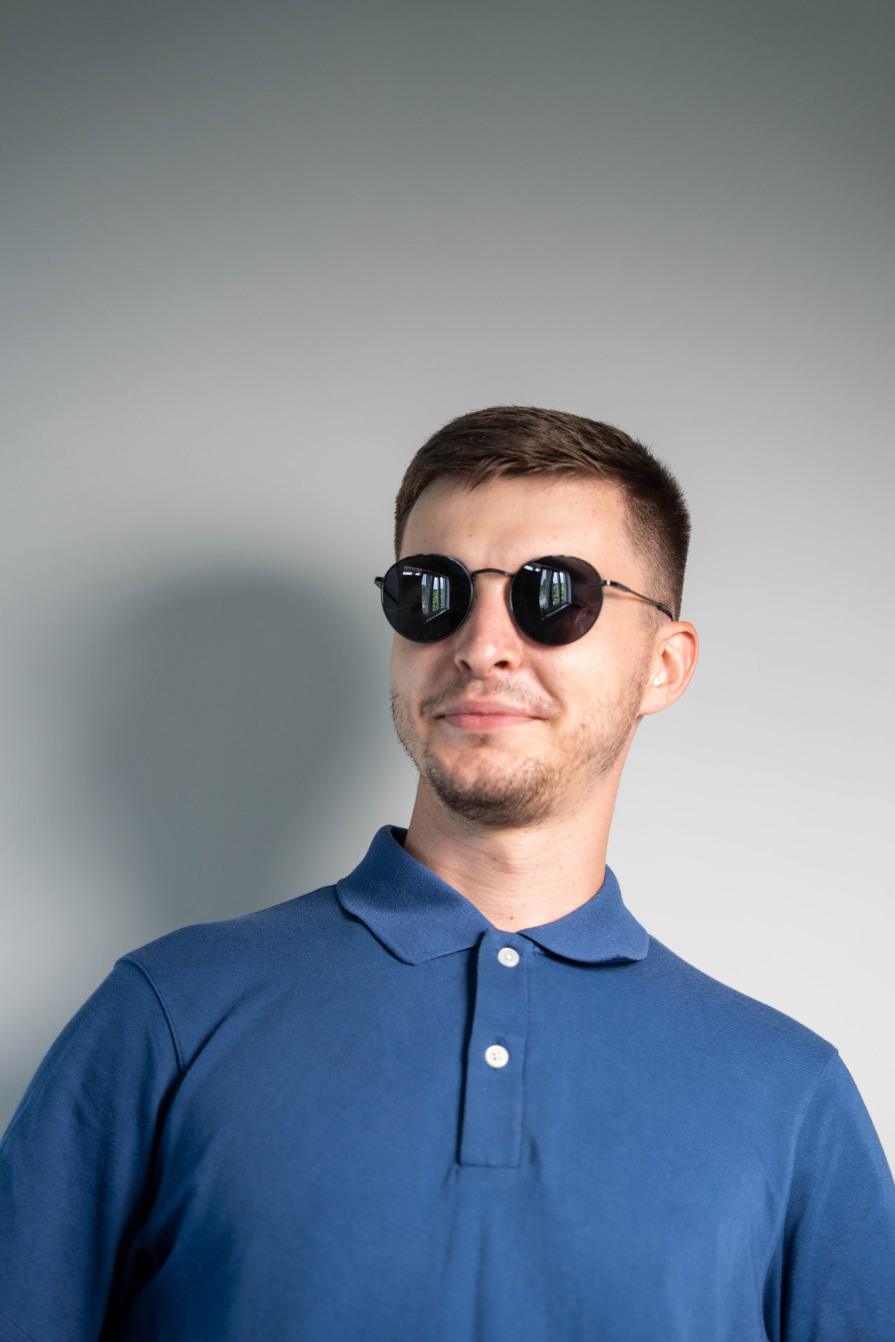 A young man in dark sunglasses